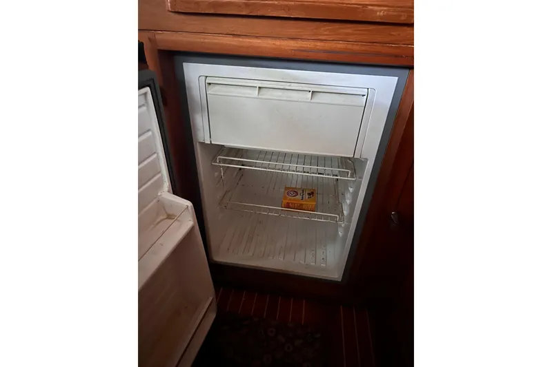 Slide: The Image of Open refrigerator on 1999 Grand Banks 46 Europa yacht with baking soda inside. - 20