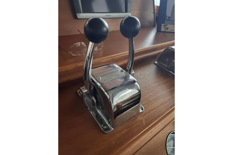 Slide: The Image of Chrome throttle controls on 1999 Grand Banks 46 Europa yacht dashboard. - 22