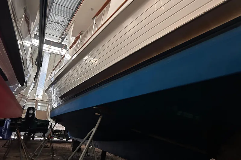 Slide: The Image of Grand Banks 46 Europa 1999 yacht in dry dock, showcasing hull and structure. - 3