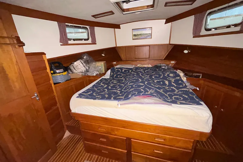 Slide: The Image of Cozy cabin interior of 1999 Grand Banks 46 Europa with wooden furnishings and a comfortable bed. - 31