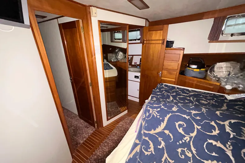 Slide: The Image of Interior of 1999 Grand Banks 46 Europa yacht with wood paneling and cozy cabin space. - 32