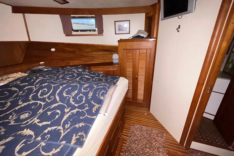 Slide: The Image of Cozy cabin interior of 1999 Grand Banks 46 Europa yacht with wooden furnishings. - 33