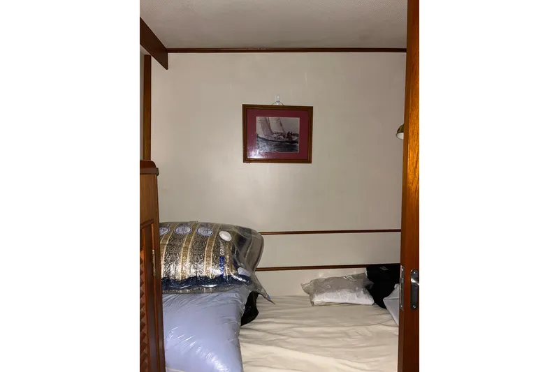 Slide: The Image of Cozy cabin interior of 1999 Grand Banks 46 Europa with framed nautical artwork. - 36