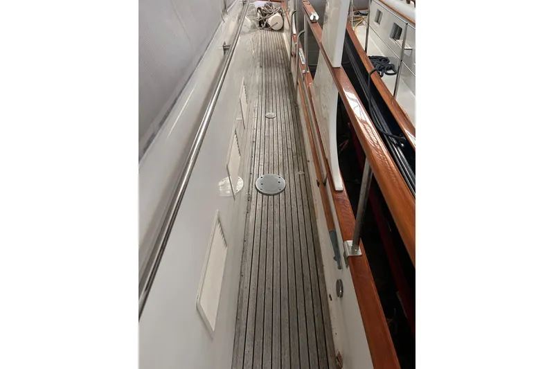 Slide: The Image of Deck view of 1999 Grand Banks 46 Europa yacht with wooden railings. - 45