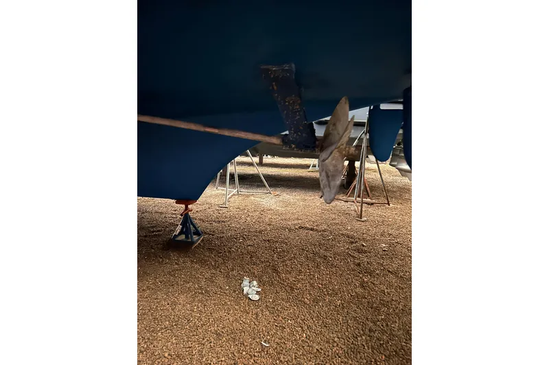 Slide: The Image of Underneath view of a 1999 Grand Banks 46 Europa boat, showing propeller and hull. - 49