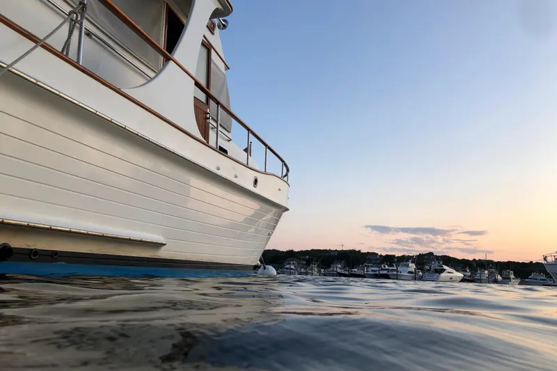 Slide: The Image of Grand Banks 46 Europa yacht on calm water at sunset, 1999 model. - 5