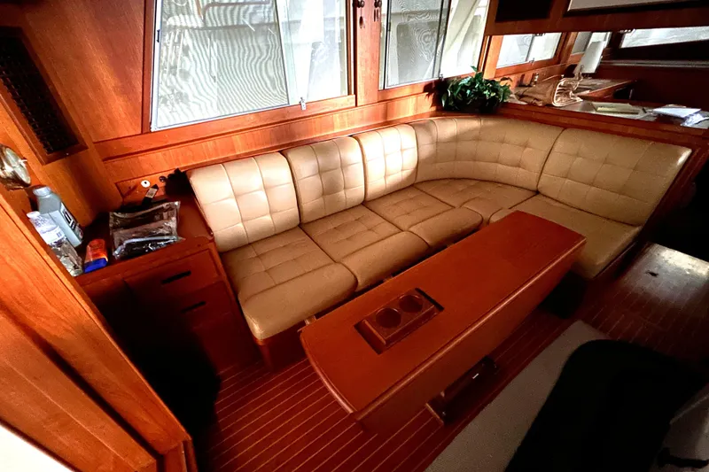 Slide: The Image of Luxurious interior of 1999 Grand Banks 46 Europa yacht with leather seating and wooden accents. - 9