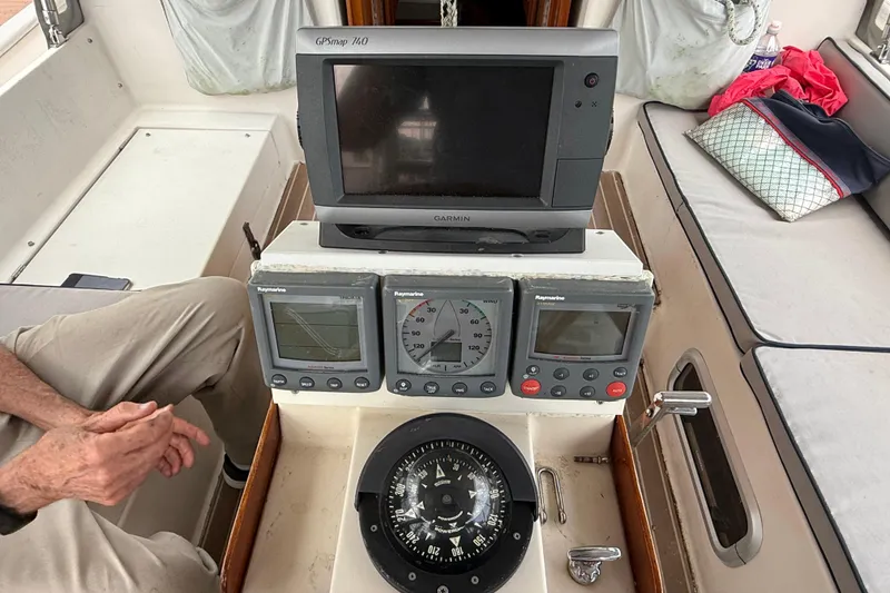 Slide: The Image of Cockpit of 1990 Gozzard 31 sailboat with navigation instruments and compass. - 15