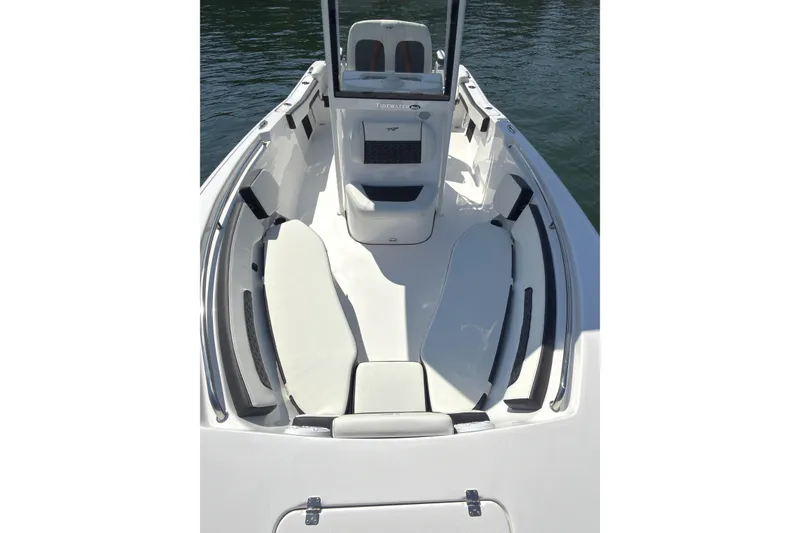 Slide: The Image of 2026 Tidewater 220 LXF boat interior with cushioned seating and sleek design. - 7