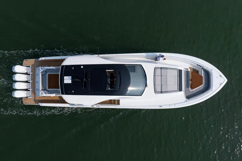 Slide: The Image of 2026 Valhalla Boatworks V-55 Sport Yacht cruising on water, aerial view. - 2