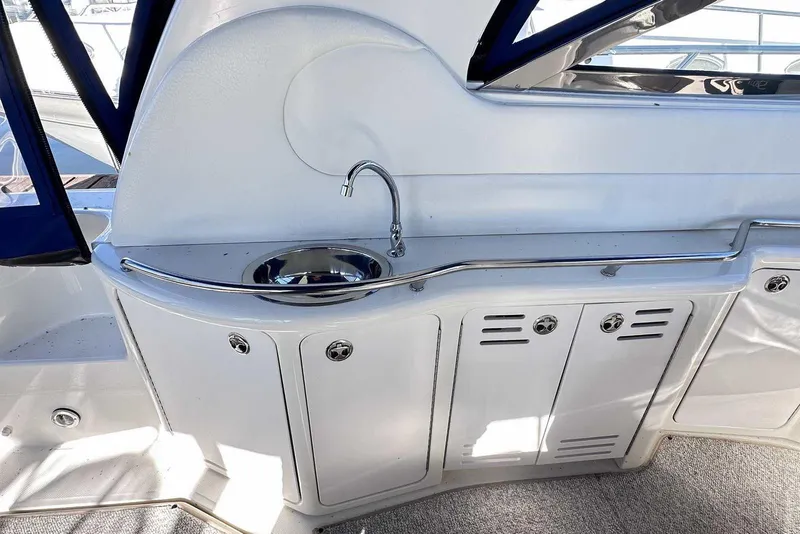 Slide: The Image of 2000 Sea Ray 410 Sundancer yacht interior with sink and storage cabinets. - 11