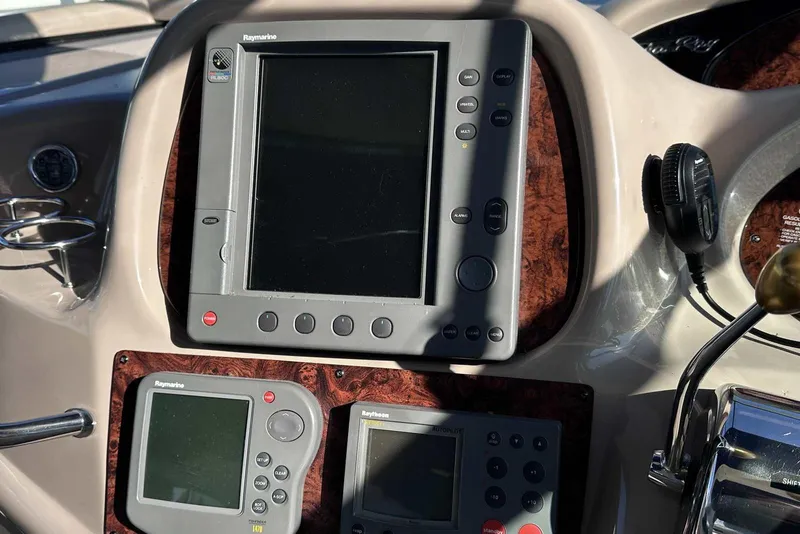 Slide: The Image of Control panel of a 2000 Sea Ray 410 Sundancer with Raymarine navigation equipment. - 16