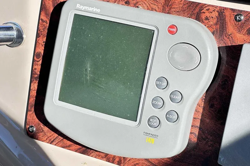 Slide: The Image of Raymarine fishfinder on 2000 Sea Ray 410 Sundancer boat dashboard. - 17