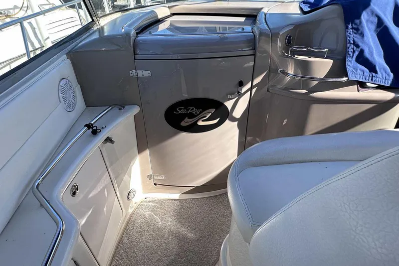 Slide: The Image of Interior of a 2000 Sea Ray 410 Sundancer boat, featuring seating and storage. - 18