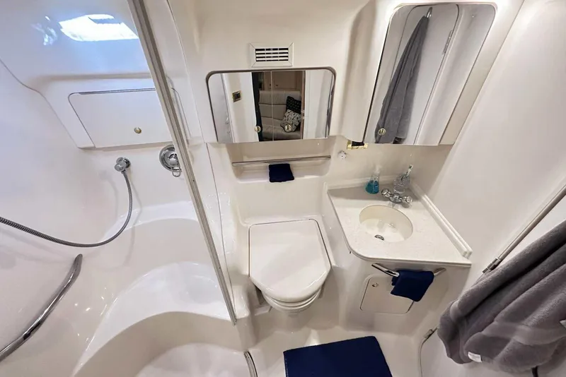 Slide: The Image of Luxurious bathroom in 2000 Sea Ray 410 Sundancer yacht, featuring modern fixtures and elegant design. - 39