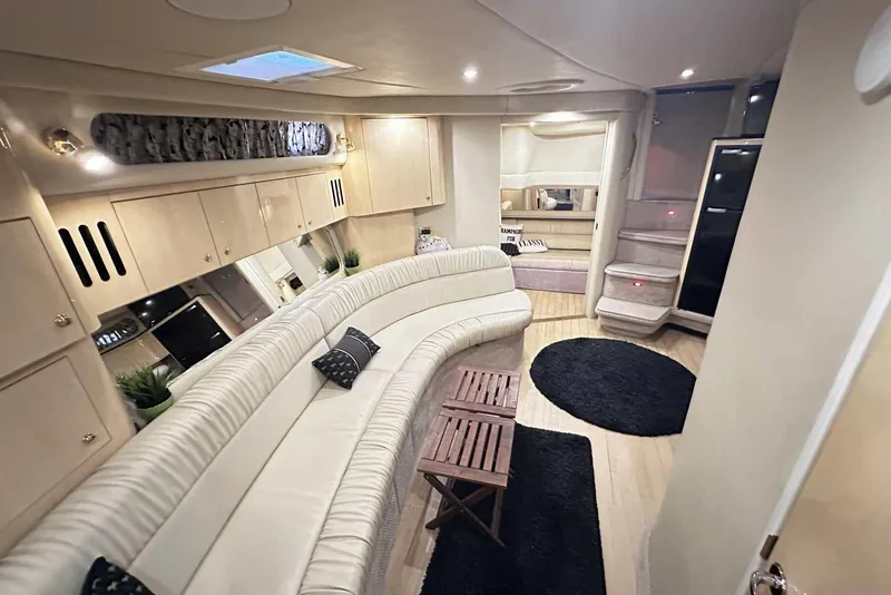 Slide: The Image of Luxurious interior of a 2000 Sea Ray 410 Sundancer yacht with elegant seating and modern decor. - 40