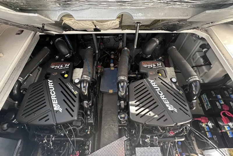 Slide: The Image of Engine compartment of a 2000 Sea Ray 410 Sundancer with twin Mercury engines. - 43