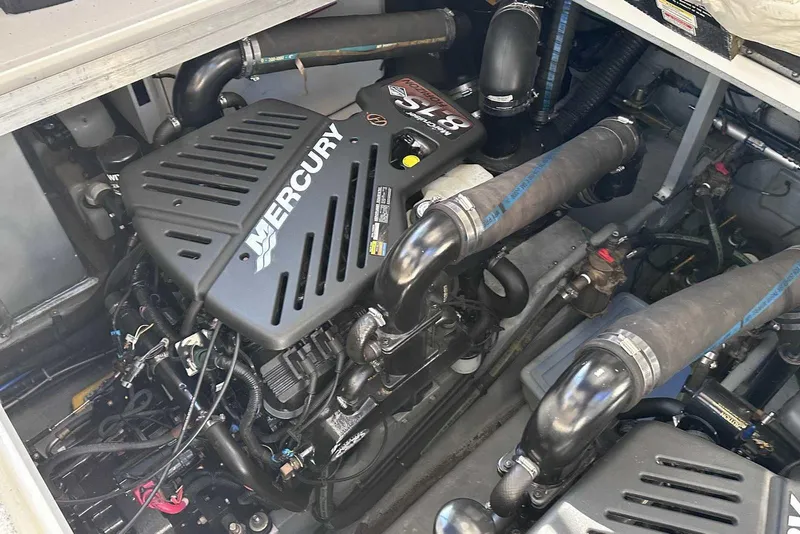 Slide: The Image of Engine compartment of a 2000 Sea Ray 410 Sundancer with Mercury engine components. - 44