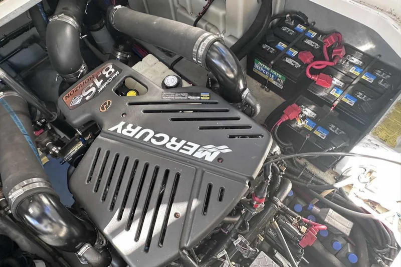 Slide: The Image of Mercury engine in 2000 Sea Ray 410 Sundancer boat with visible batteries. - 46