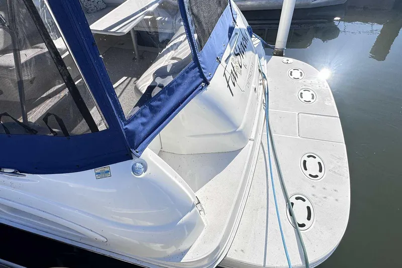 Slide: The Image of 2000 Sea Ray 410 Sundancer boat with blue canopy and spacious swim platform. - 5