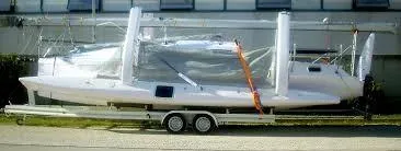 Slide: The Image of 2017 Corsair Cruze 970 #396 sailboat on trailer, parked outdoors. - 10