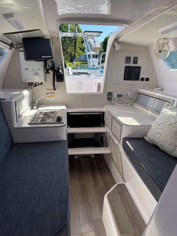Slide: The Image of Interior of 2017 Corsair Cruze 970 sailboat with modern amenities and seating. - 22