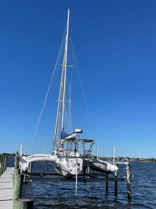 Slide: The Image of 2017 Corsair Cruze 970 #396 trimaran docked on a sunny day. - 4