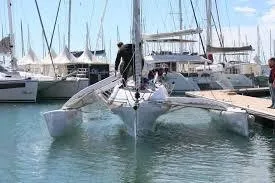 Slide: The Image of 2017 Corsair Cruze 970 trimaran docked in a marina. - 7