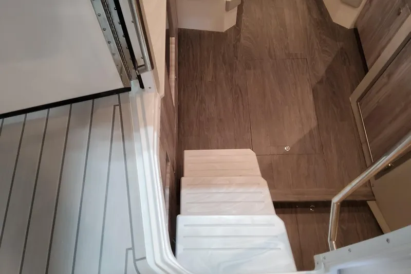 Slide: The Image of Interior stairs of 2026 Formula 400 Super Sport Crossover with wood flooring. - 102