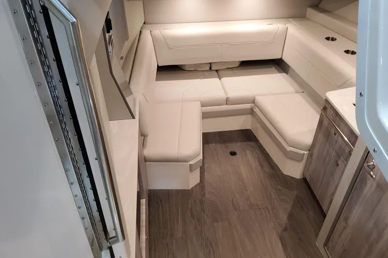 Slide: The Image of Interior of 2026 Formula 400 Super Sport Crossover with modern seating and wood flooring. - 103