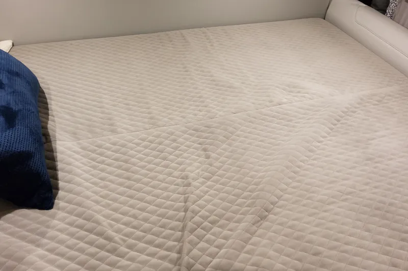 Slide: The Image of Quilted bed with blue pillow in Formula 400 Super Sport Crossover, 2026 model. - 106