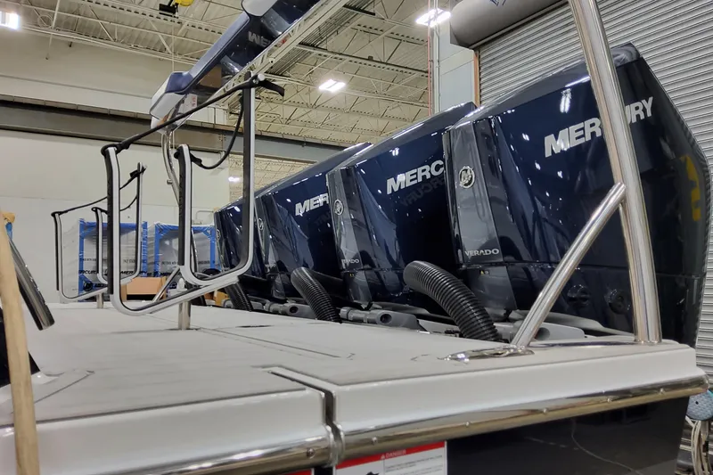 Slide: The Image of 2026 Formula 400 Super Sport Crossover with Mercury Verado engines in a warehouse setting. - 11