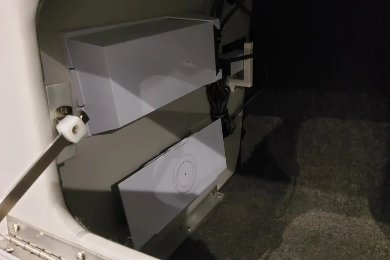 Slide: The Image of Interior view of 2026 Formula 400 Super Sport Crossover, showcasing storage compartment details. - 123