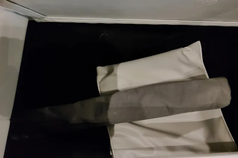 Slide: The Image of Rolled-up cover on Formula 400 Super Sport Crossover, 2026 model, in storage. - 125