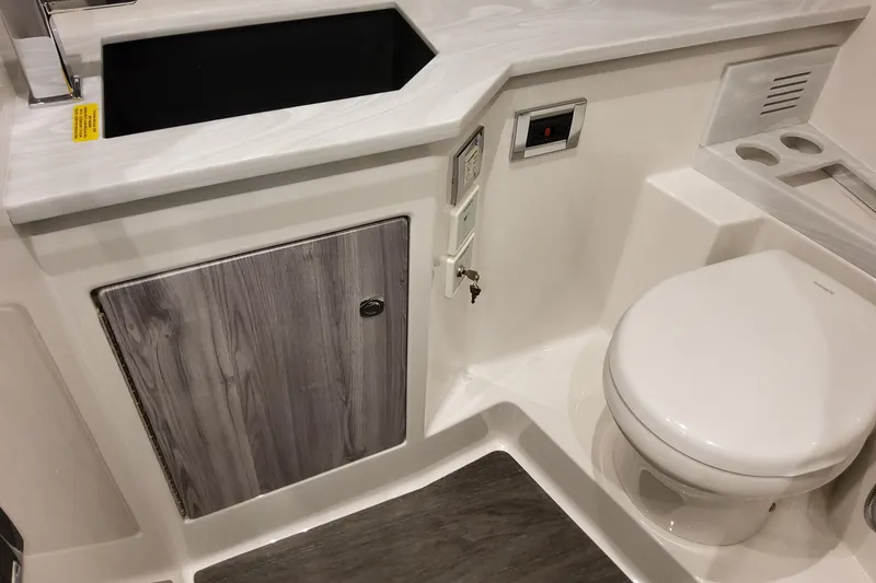 Slide: The Image of 2026 Formula 400 Super Sport Crossover bathroom with modern sink and toilet design. - 128