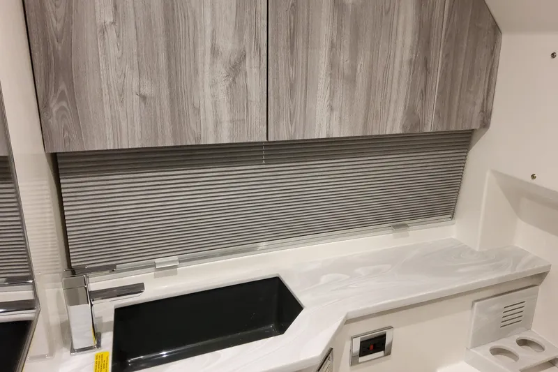 Slide: The Image of Interior of 2026 Formula 400 Super Sport Crossover with modern cabinetry and sleek countertop. - 129