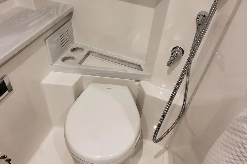 Slide: The Image of 2026 Formula 400 Super Sport Crossover bathroom with modern fixtures and compact design. - 130