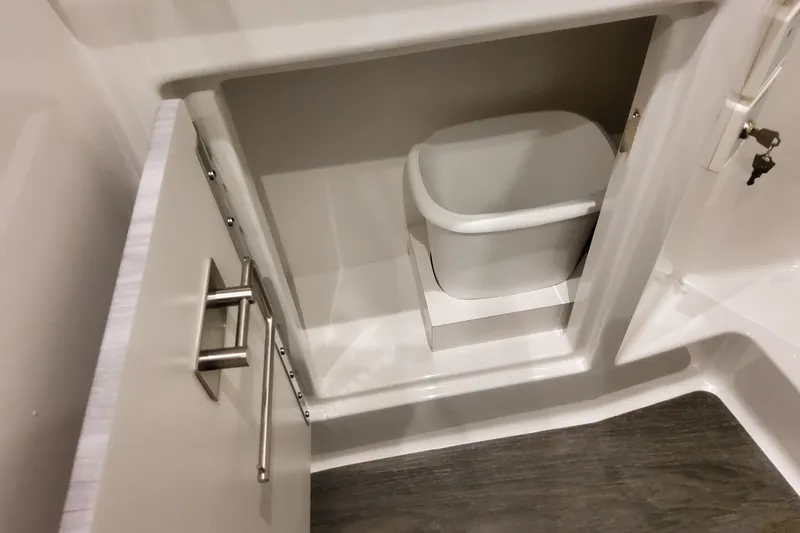 Slide: The Image of Cabinet with trash bin inside Formula 400 Super Sport Crossover, 2026 model. - 132