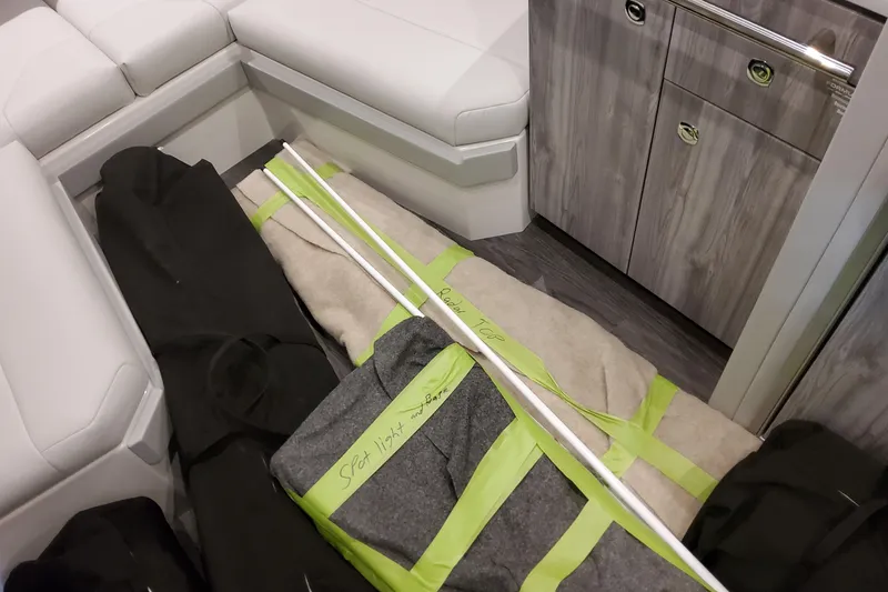 Slide: The Image of Interior of 2026 Formula 400 Super Sport Crossover with stored equipment and seating. - 134