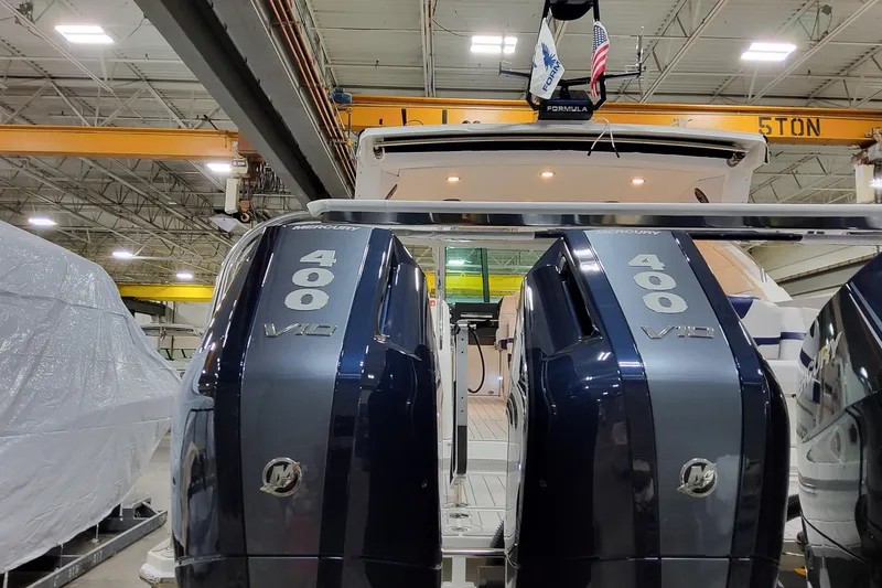 Slide: The Image of 2026 Formula 400 Super Sport Crossover with dual Mercury 400 V10 engines in a warehouse. - 14