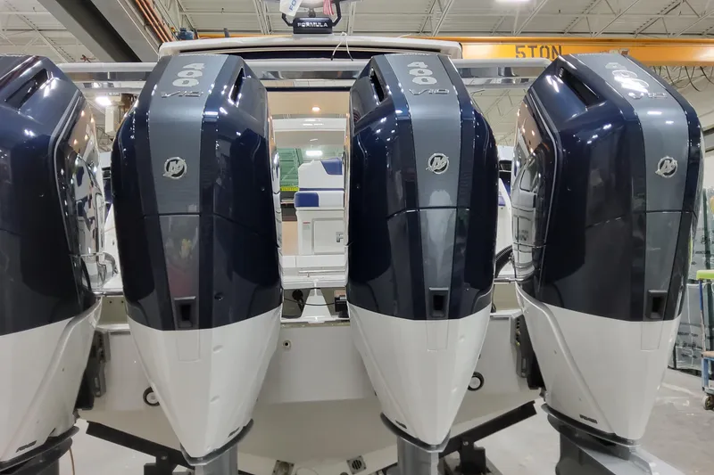 Slide: The Image of 2026 Formula 400 Super Sport Crossover with four powerful outboard engines in a showroom. - 16