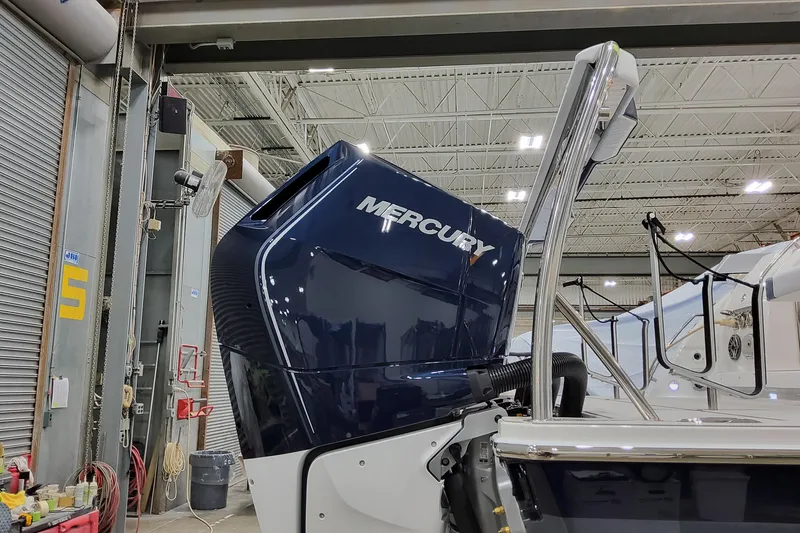 Slide: The Image of 2026 Formula 400 Super Sport Crossover with Mercury engine in a showroom. - 17