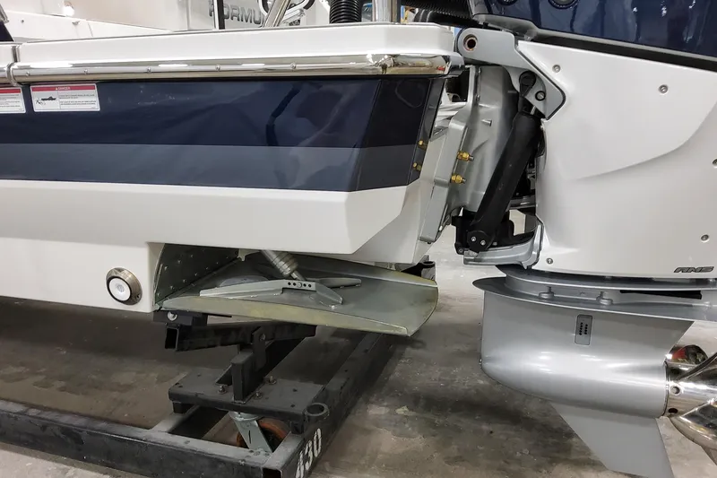 Slide: The Image of 2026 Formula 400 Super Sport Crossover boat engine and stern detail in a workshop. - 19