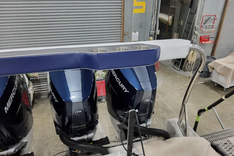 Slide: The Image of 2026 Formula 400 Super Sport Crossover with Mercury outboard engines in a workshop setting. - 25