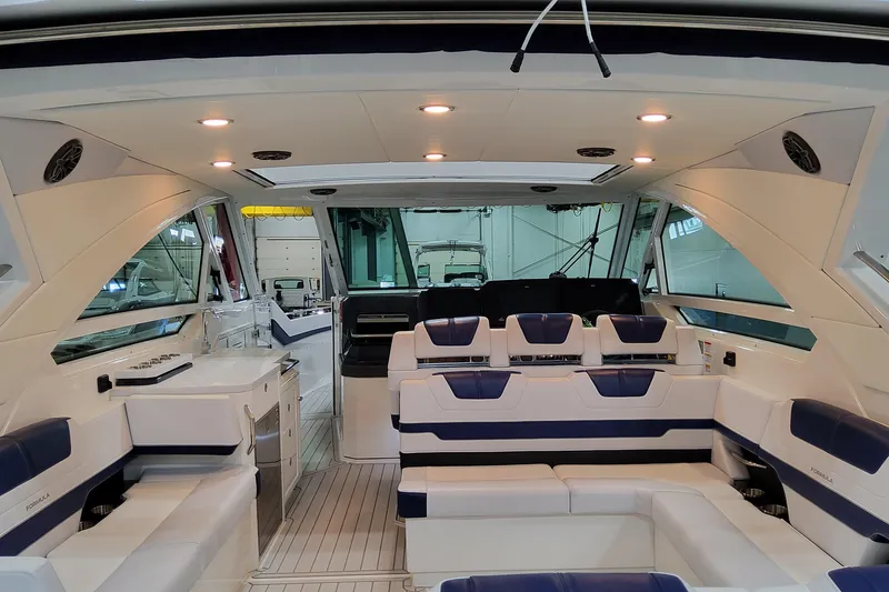 Slide: The Image of Luxurious interior of 2026 Formula 400 Super Sport Crossover yacht with plush seating. - 28
