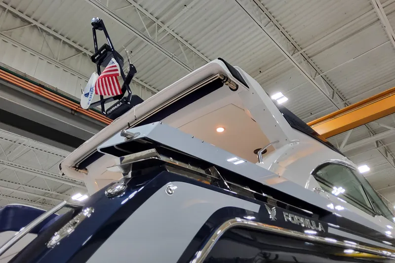 Slide: The Image of 2026 Formula 400 Super Sport Crossover yacht in a warehouse, showcasing sleek design and craftsmanship. - 3