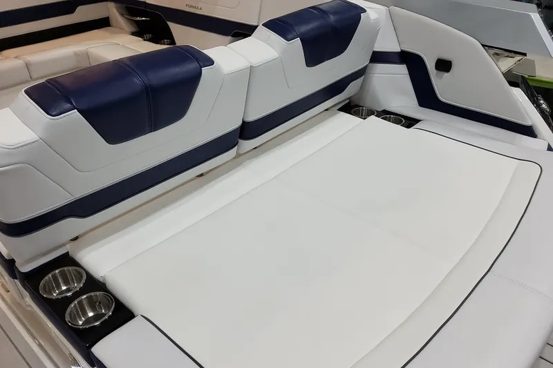 Slide: The Image of 2026 Formula 400 Super Sport Crossover boat interior with white and blue seating. - 31