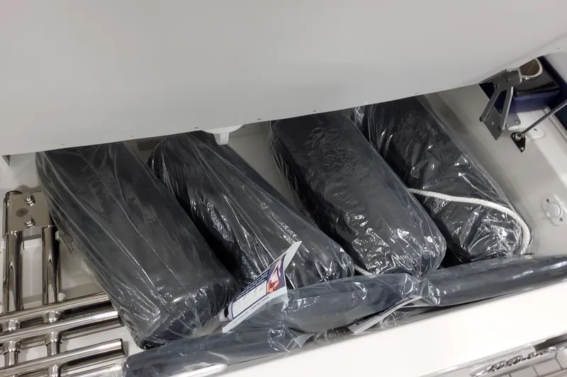 Slide: The Image of 2026 Formula 400 Super Sport Crossover storage compartment with packaged cushions. - 33