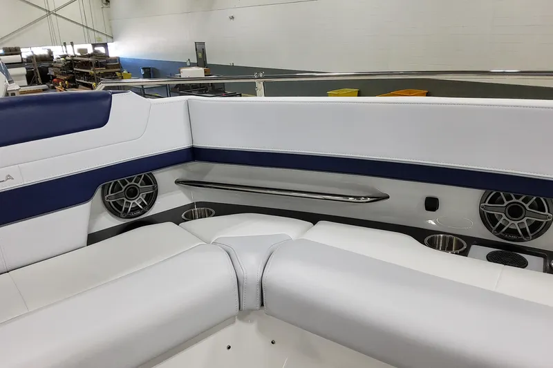 Slide: The Image of Interior seating of 2026 Formula 400 Super Sport Crossover with speakers and cup holders. - 46