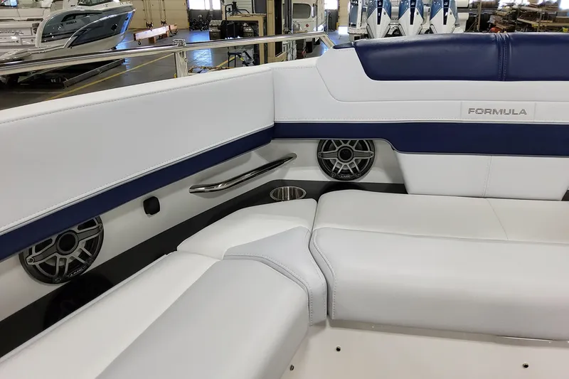 Slide: The Image of 2026 Formula 400 Super Sport Crossover interior with white and blue seating, speakers, and cup holders. - 48